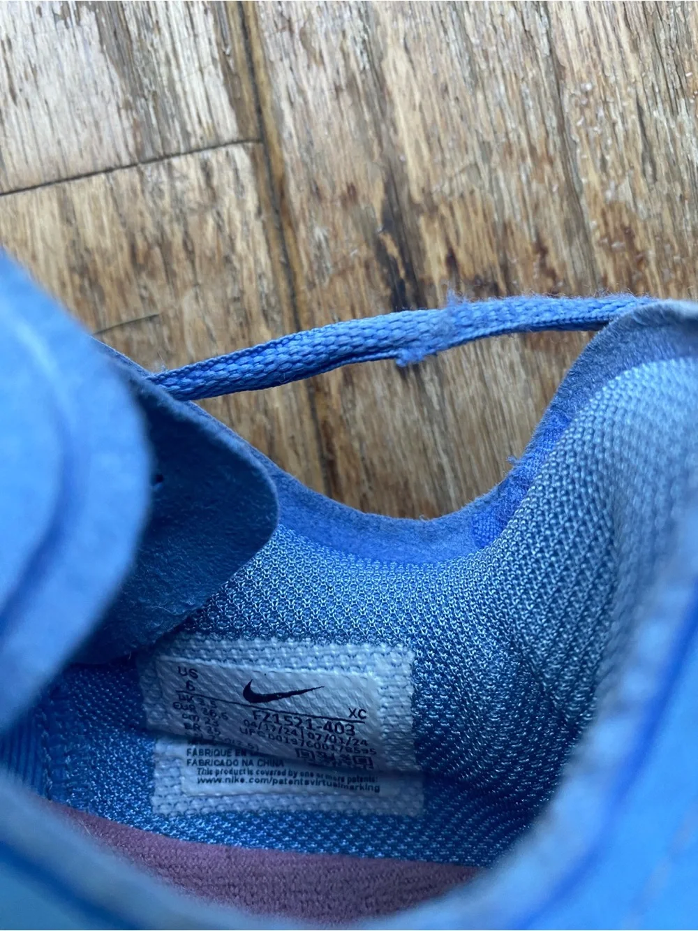 Nike Blue Low-Top Trainers with White and Red Swoosh